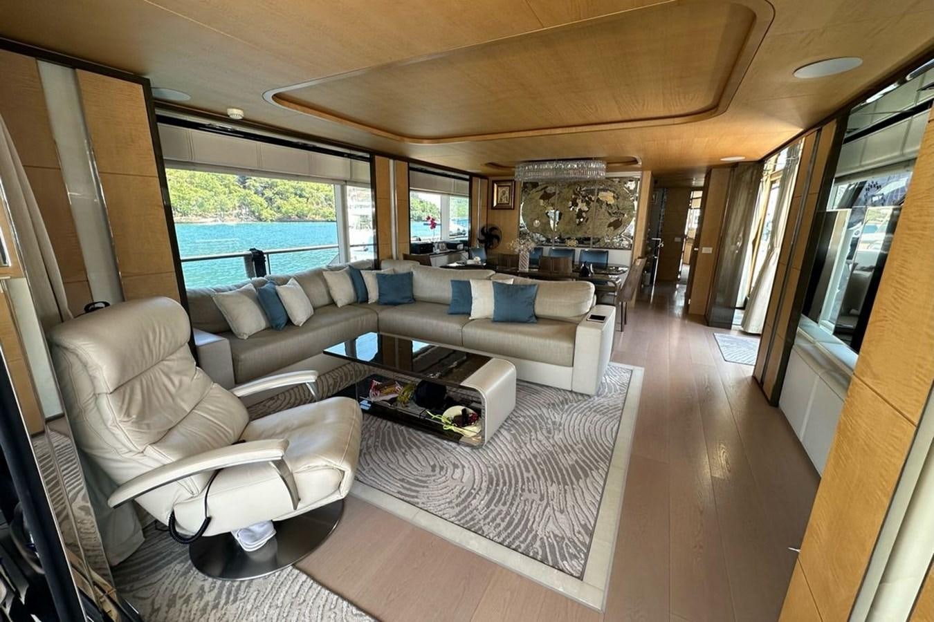 a living room with a large window aboard REKOMA Yacht for Sale