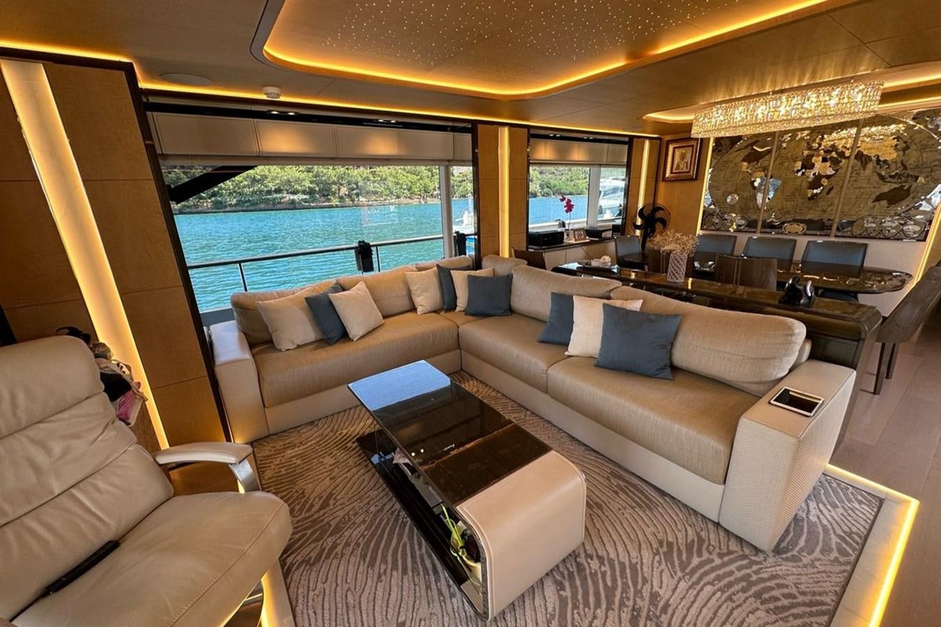 a living room with a large window aboard REKOMA Yacht for Sale