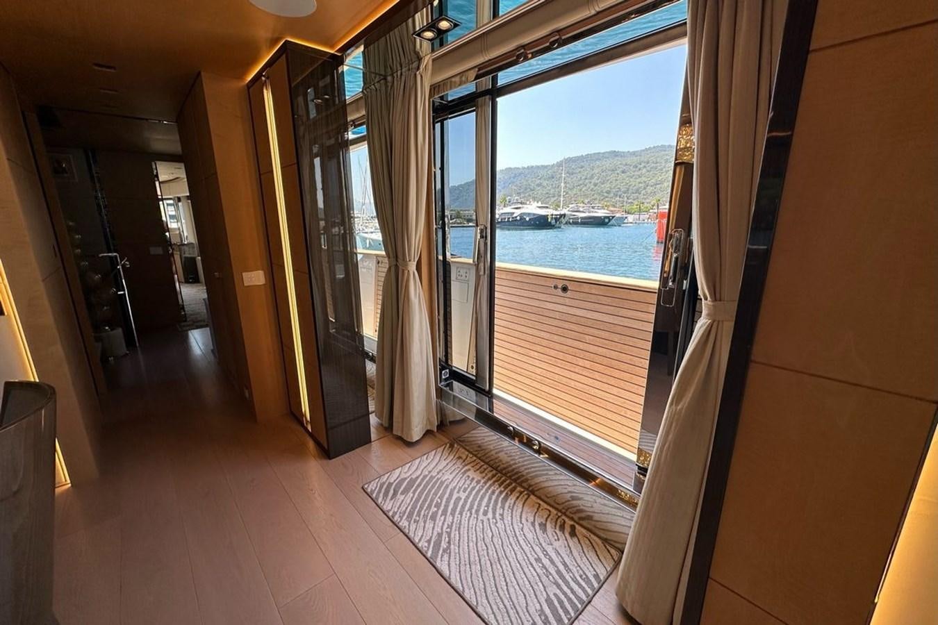 a room with a large window and a view of the water aboard REKOMA Yacht for Sale