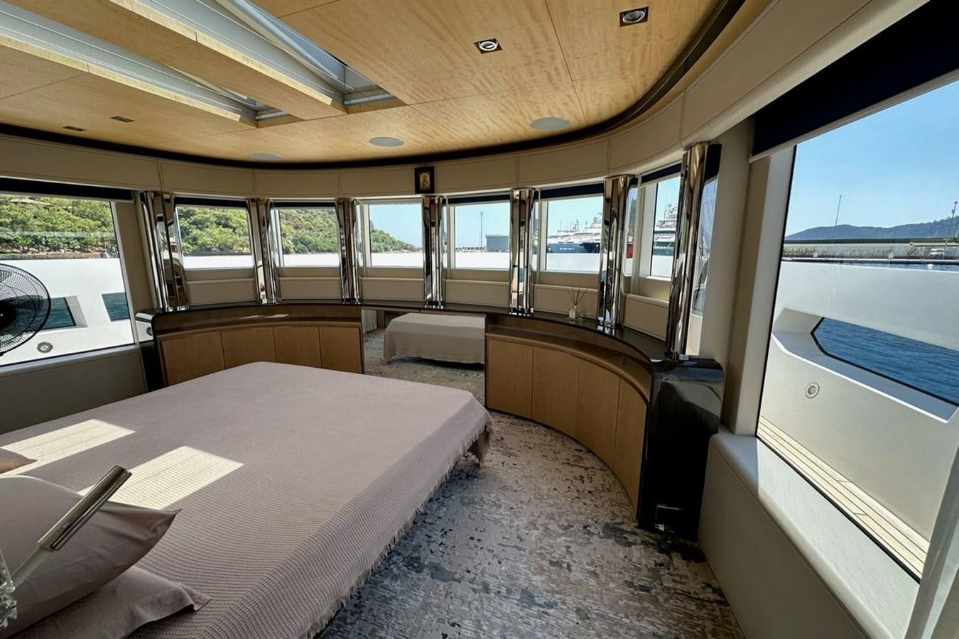 a boat with a table and chairs aboard REKOMA Yacht for Sale