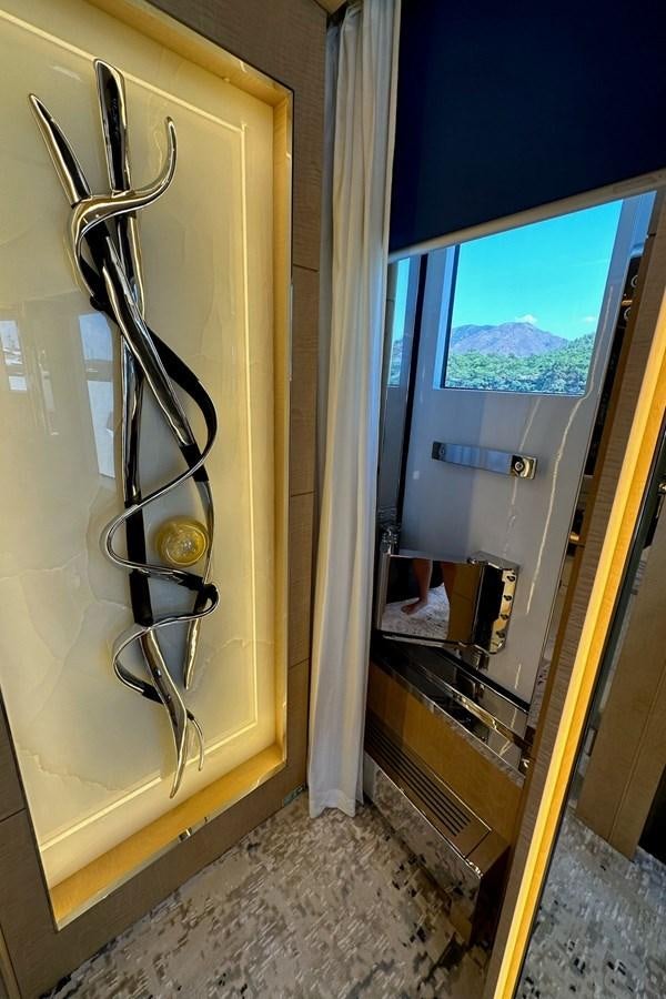 a bathroom with a large mirror aboard REKOMA Yacht for Sale