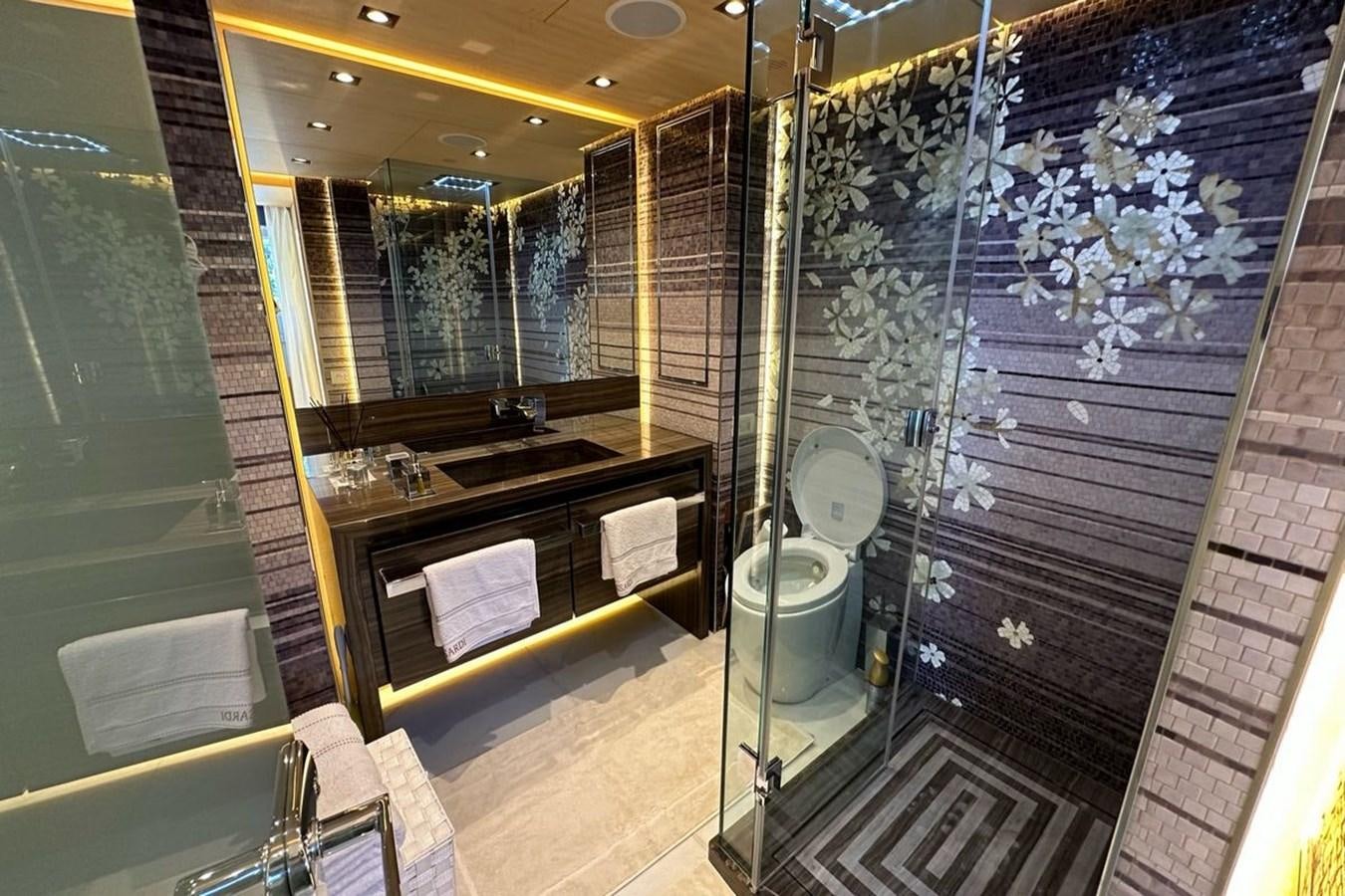 a bathroom with a glass shower aboard REKOMA Yacht for Sale