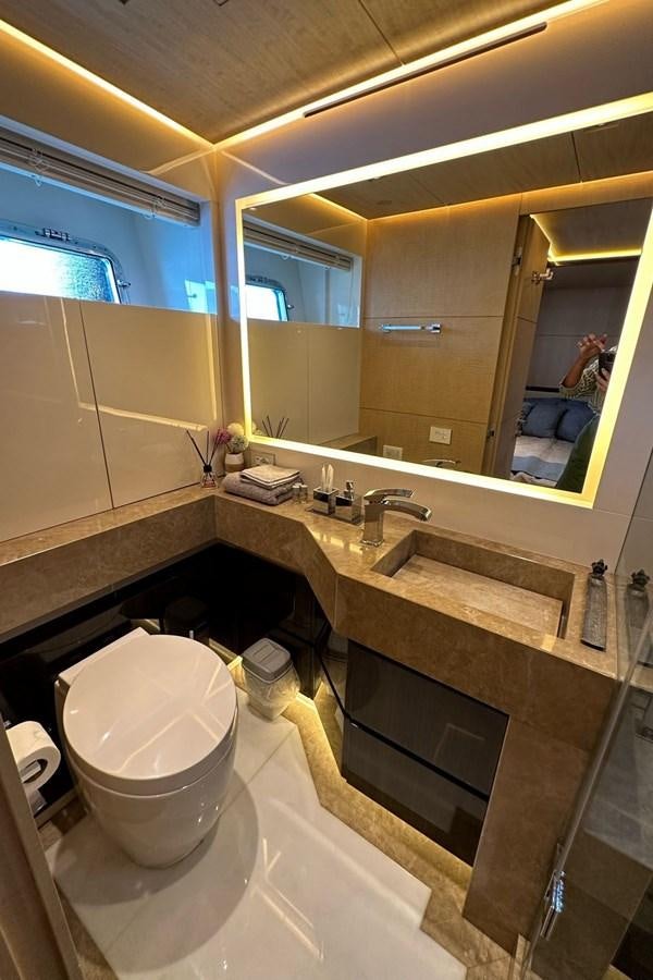 a bathroom with a large mirror aboard REKOMA Yacht for Sale