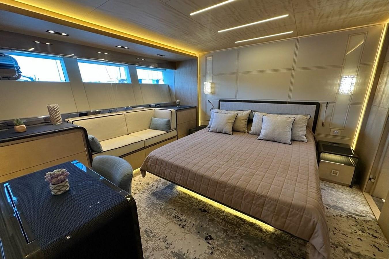 a room with a bed and a desk aboard REKOMA Yacht for Sale