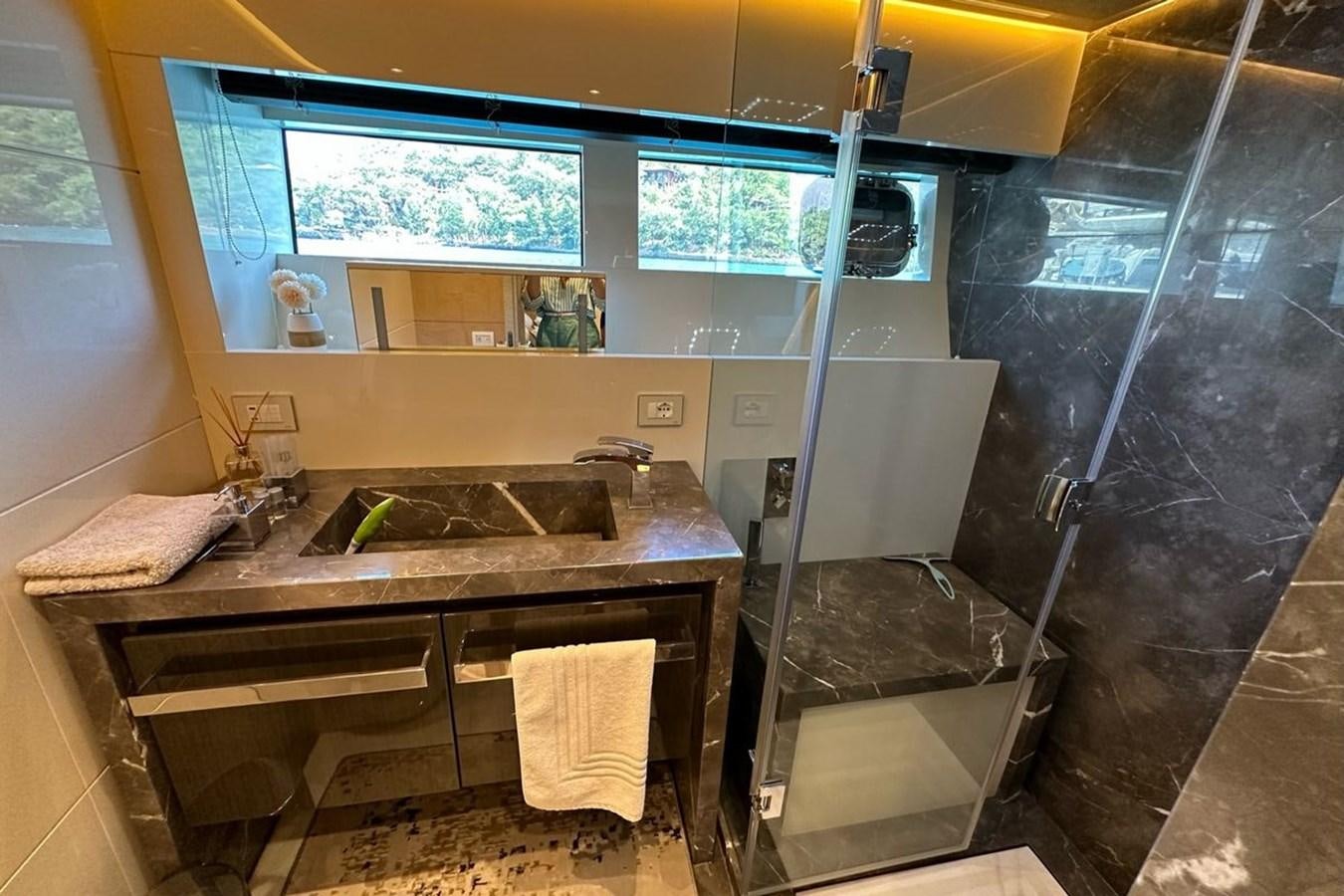 a bathroom with a sink and a ladder aboard REKOMA Yacht for Sale