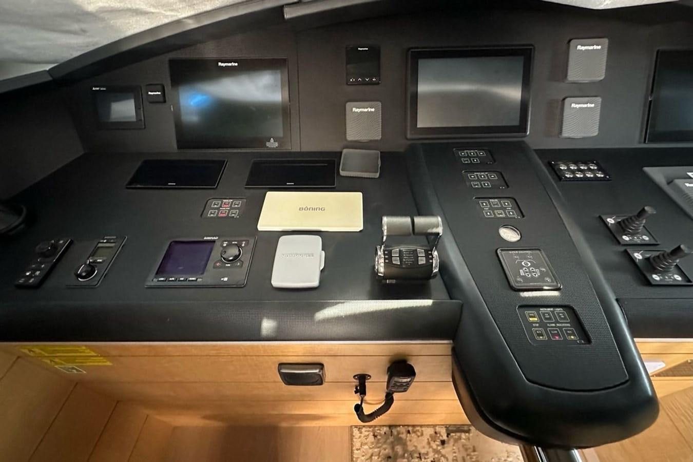 a black console with a few buttons aboard REKOMA Yacht for Sale