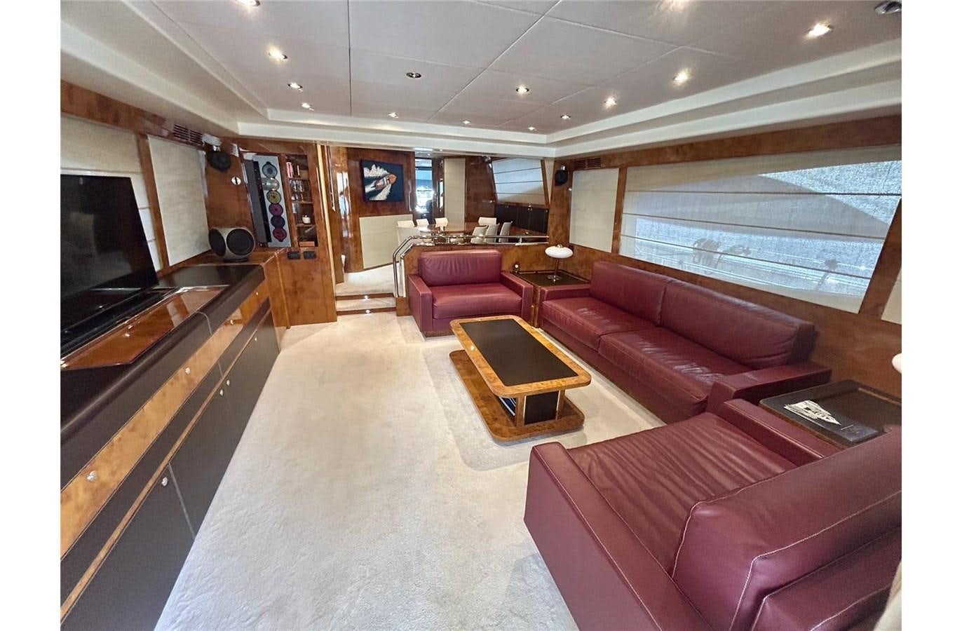 a living room with a fireplace aboard 888 Yacht for Sale