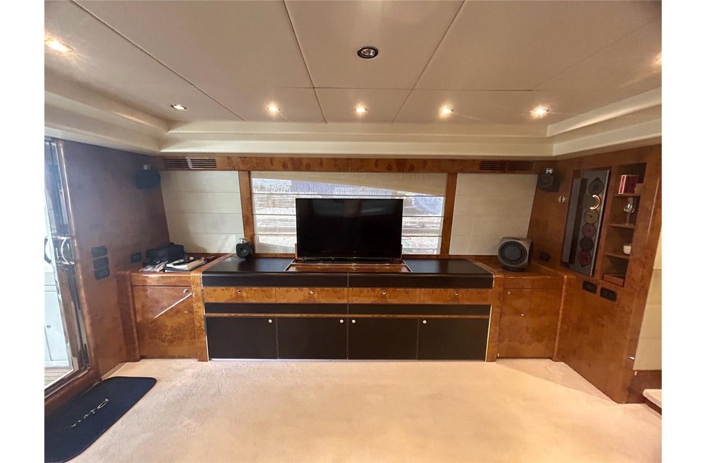 a room with a tv and a bed aboard 888 Yacht for Sale