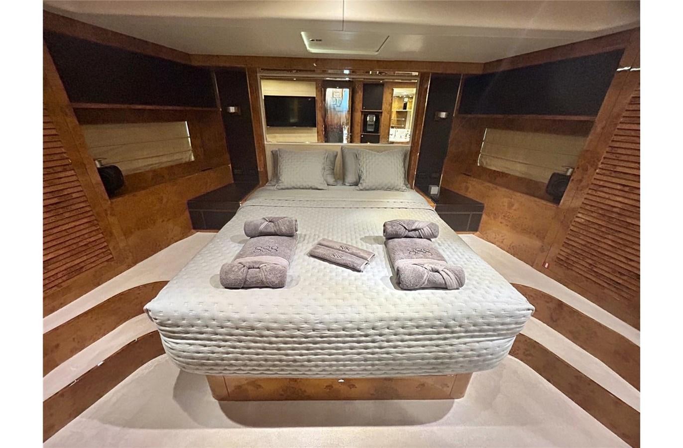 a large bed in a room aboard 888 Yacht for Sale