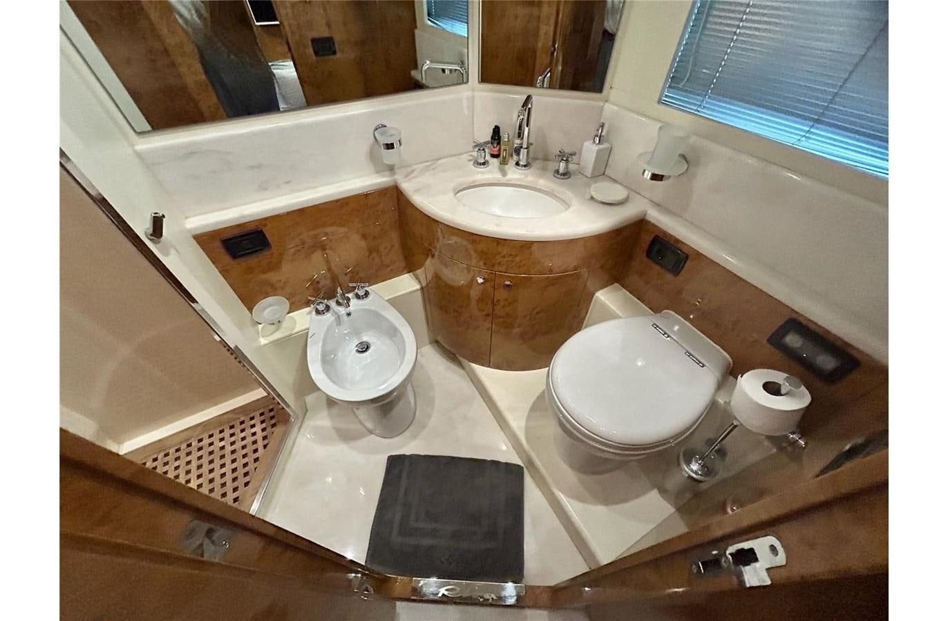 a bathroom with a sink and a toilet aboard 888 Yacht for Sale