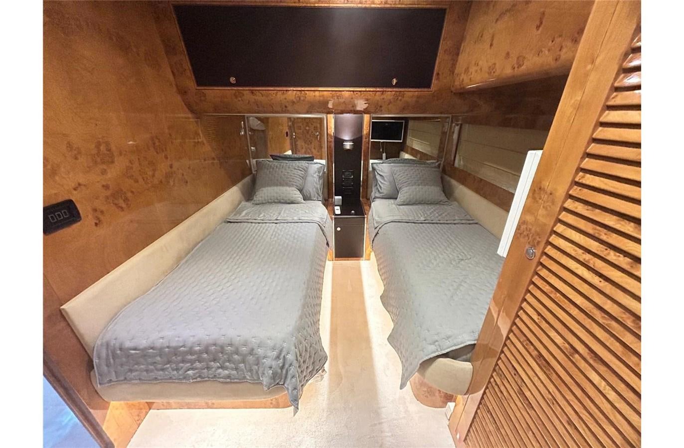 a bed in a room aboard 888 Yacht for Sale