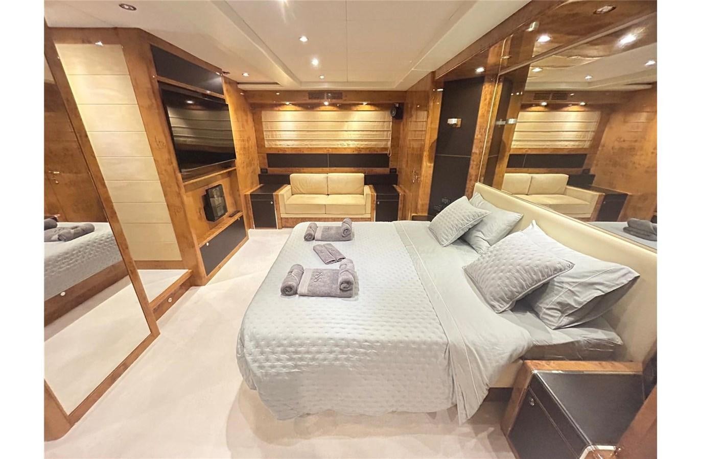 a large bedroom with a large bed aboard 888 Yacht for Sale
