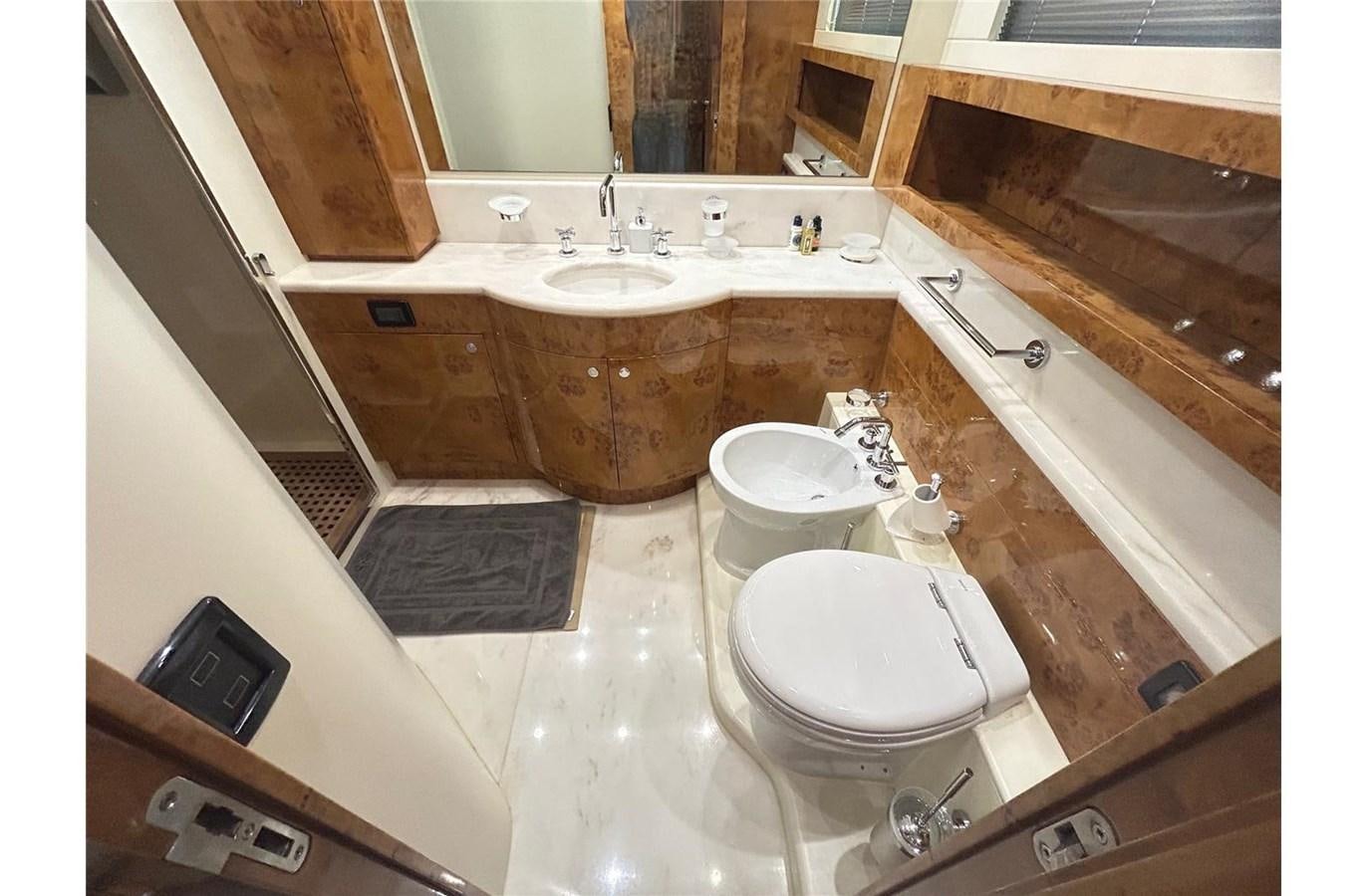 a bathroom with a tub sink and a sink aboard 888 Yacht for Sale