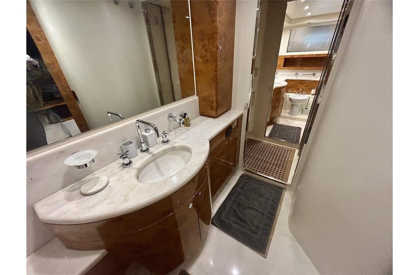 a bathroom with a sink and a mirror aboard 888 Yacht for Sale