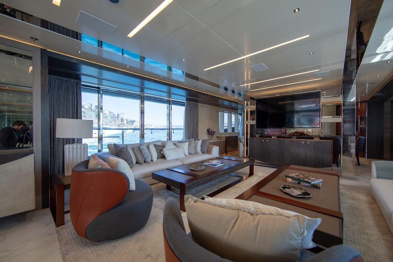 a living room with a large window aboard STARBURST III Yacht for Sale
