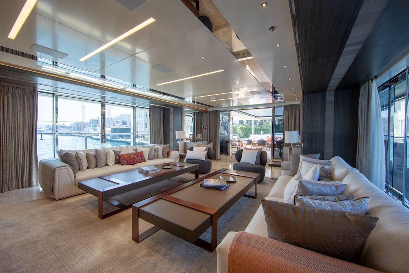 a living room with a large window aboard STARBURST III Yacht for Sale