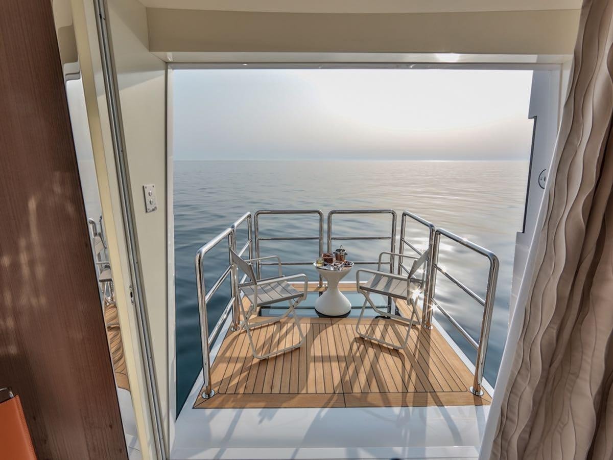 a balcony overlooking the ocean aboard STARBURST III Yacht for Sale
