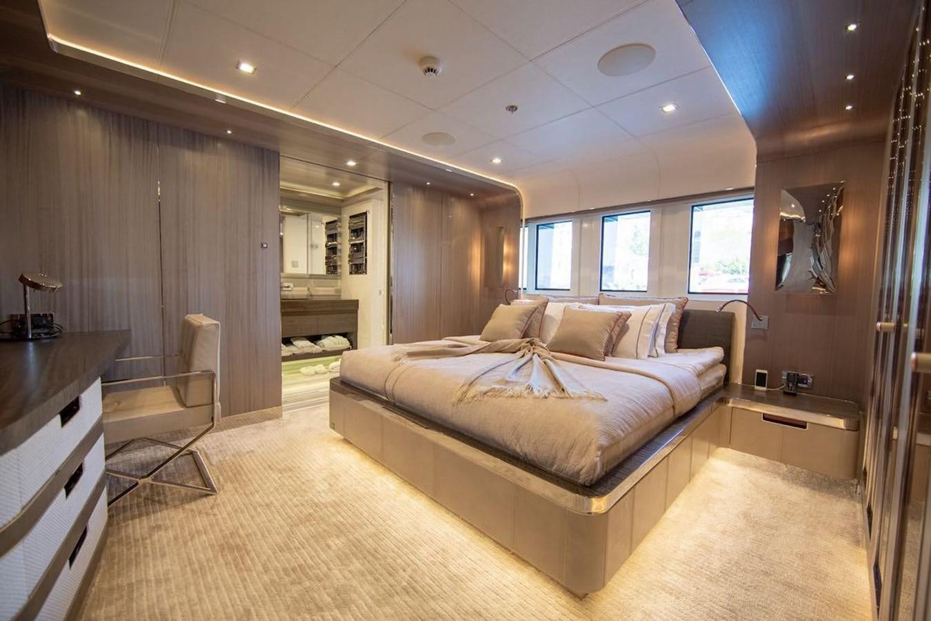a large bedroom with a large bed aboard STARBURST III Yacht for Sale