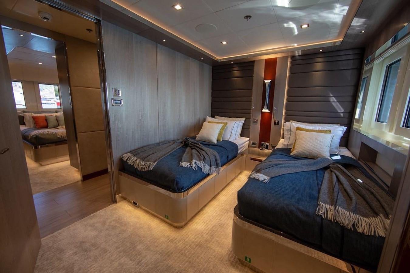 a room with a bed and a couch aboard STARBURST III Yacht for Sale