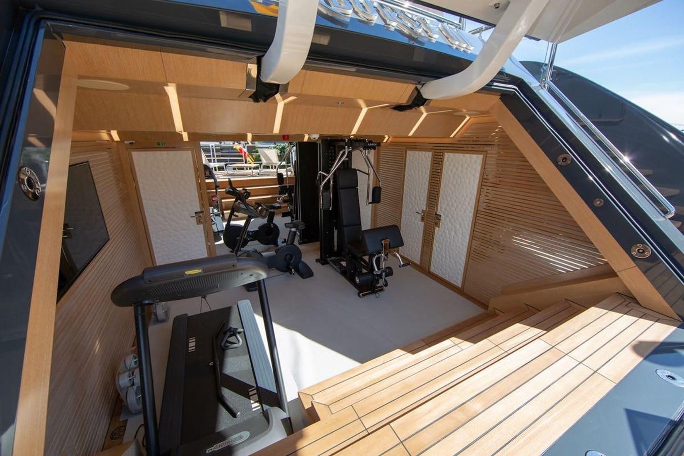 a gym with equipment and equipment aboard STARBURST III Yacht for Sale