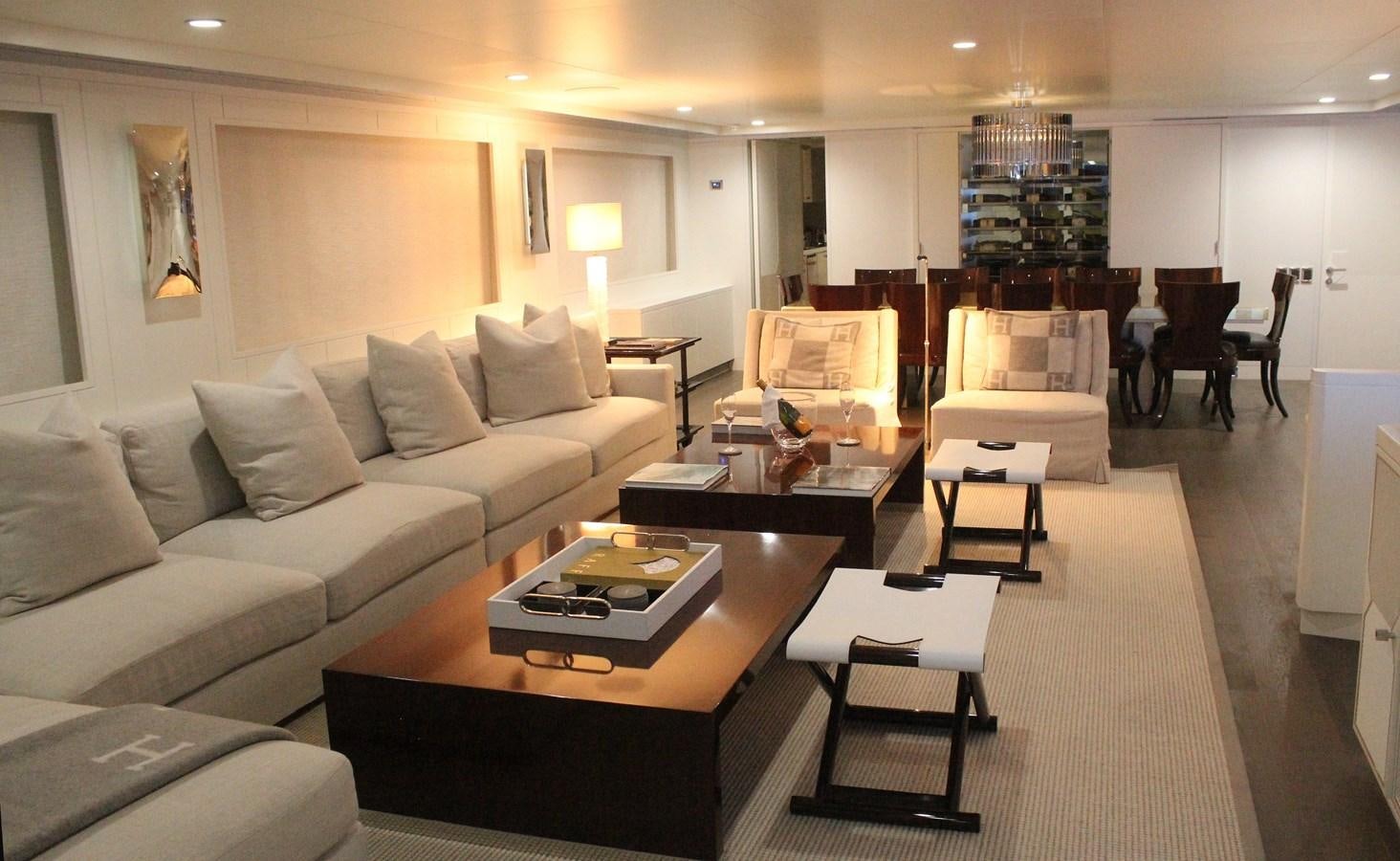 a living room with a couch and coffee table aboard BG Yacht for Sale