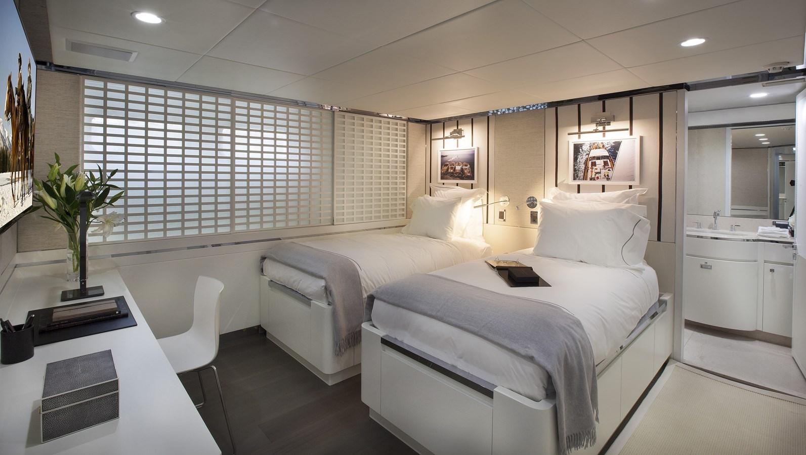 a room with white beds aboard BG Yacht for Sale