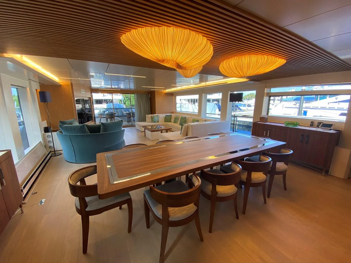 a large kitchen with a table and chairs aboard PERSISTENCE Yacht for Sale