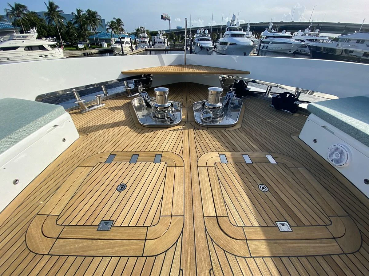 a wooden deck with a large metal object on it aboard PERSISTENCE Yacht for Sale