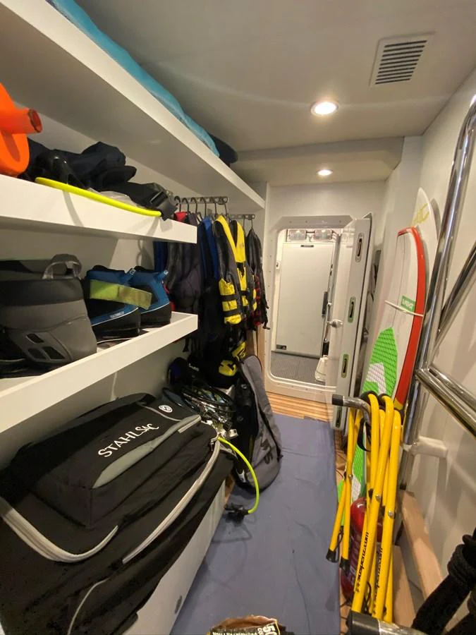 a vehicle with clothes on the rack aboard PERSISTENCE Yacht for Sale