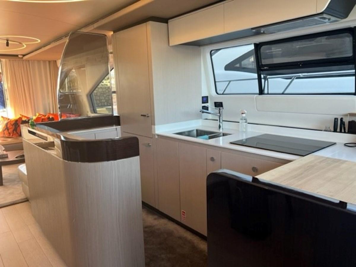 a kitchen with a large window aboard SOLSTICE Yacht for Sale