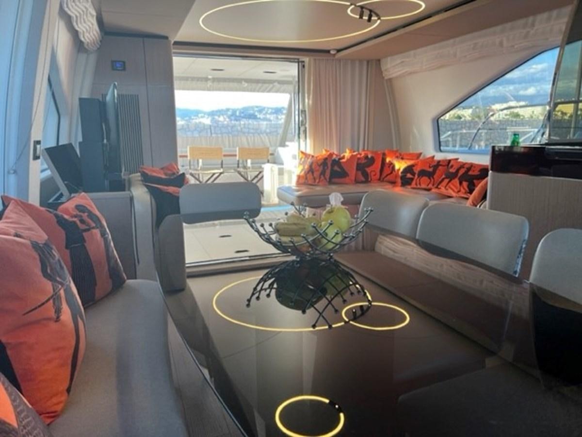 a room with a table and chairs aboard SOLSTICE Yacht for Sale