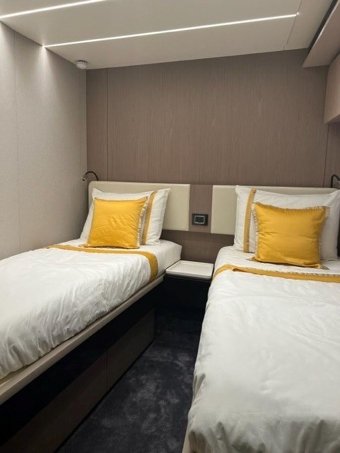 a couple of beds in a hotel room aboard SOLSTICE Yacht for Sale