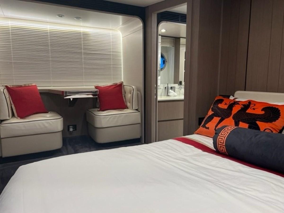 a bedroom with a bed and a mirror aboard SOLSTICE Yacht for Sale