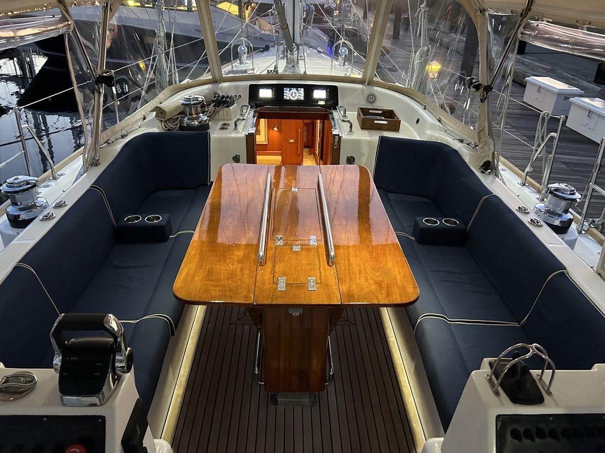 a room with a table and chairs aboard TRIUMPH Yacht for Sale