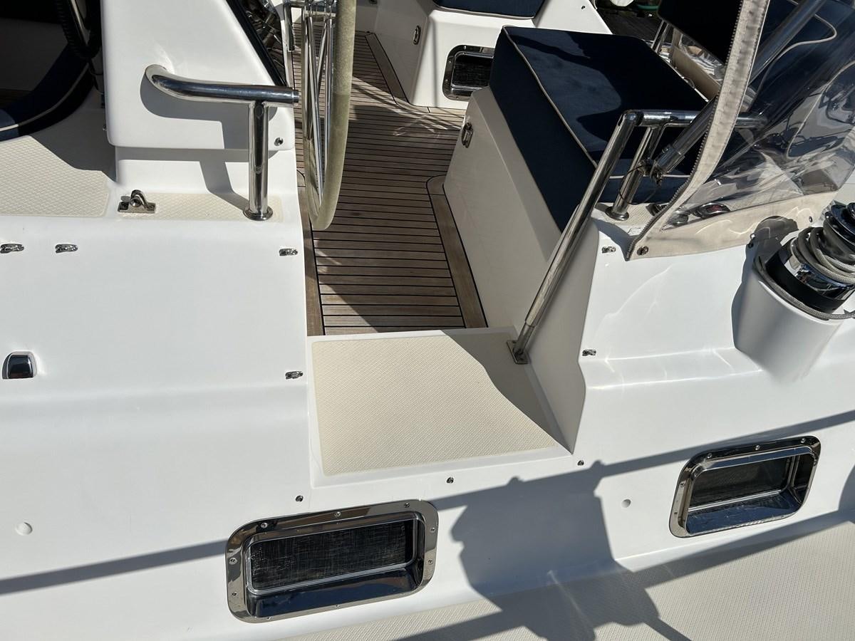 a white car with a door open aboard TRIUMPH Yacht for Sale