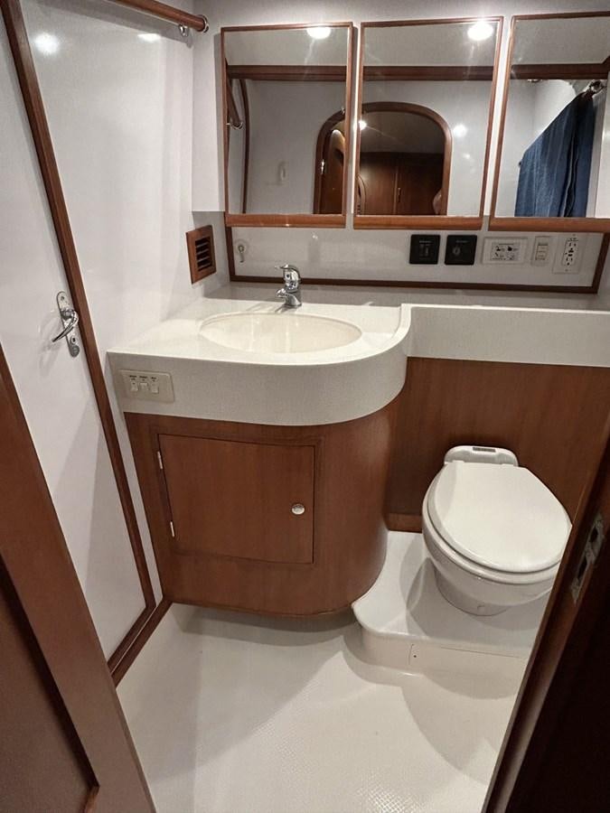 a bathroom with a sink and a toilet aboard TRIUMPH Yacht for Sale