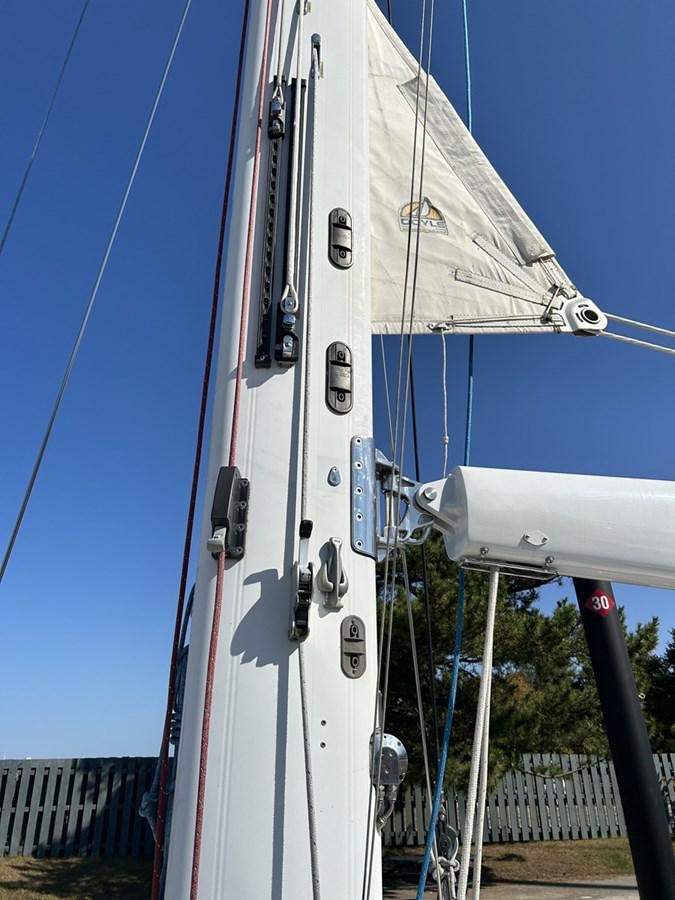 a white boat on a dock aboard TRIUMPH Yacht for Sale