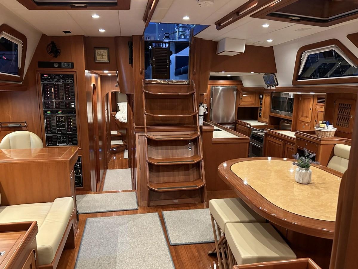 a kitchen with wooden cabinets aboard TRIUMPH Yacht for Sale