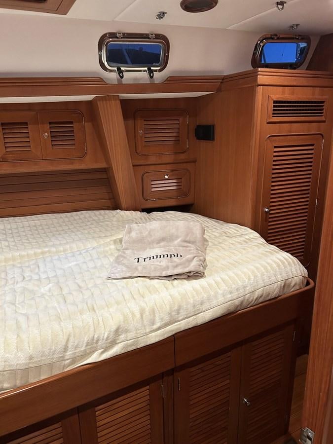a bed in a room aboard TRIUMPH Yacht for Sale