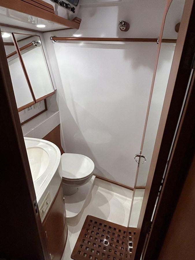 a bathroom with a shower aboard TRIUMPH Yacht for Sale