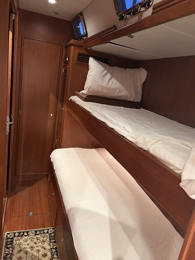 a room with two beds aboard TRIUMPH Yacht for Sale