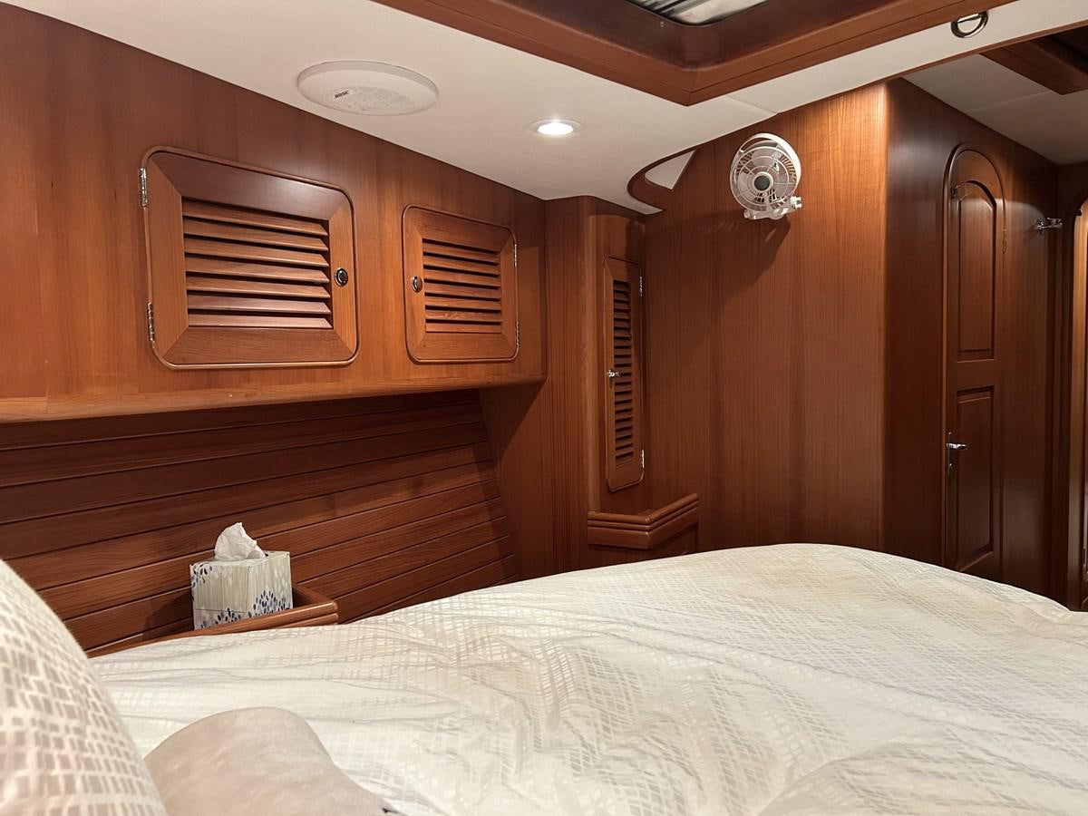 a bed in a room aboard TRIUMPH Yacht for Sale