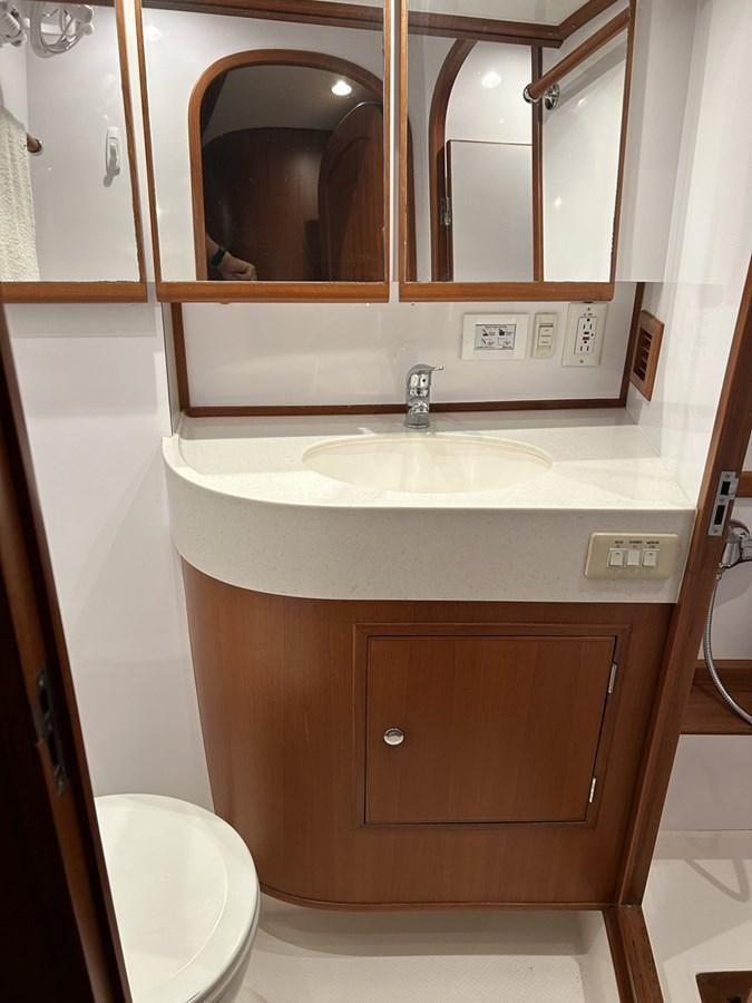 a bathroom with a sink and a toilet aboard TRIUMPH Yacht for Sale
