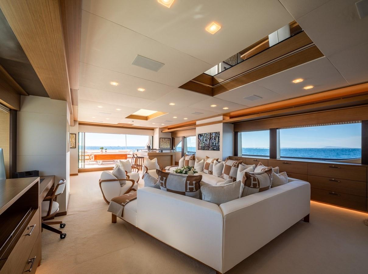 a living room with a large window aboard QUANTUM H Yacht for Sale