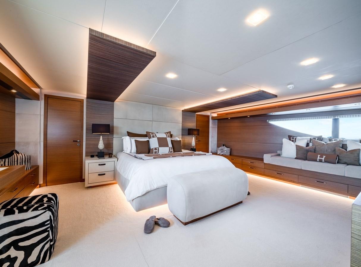 a room with a bed and a couch aboard QUANTUM H Yacht for Sale