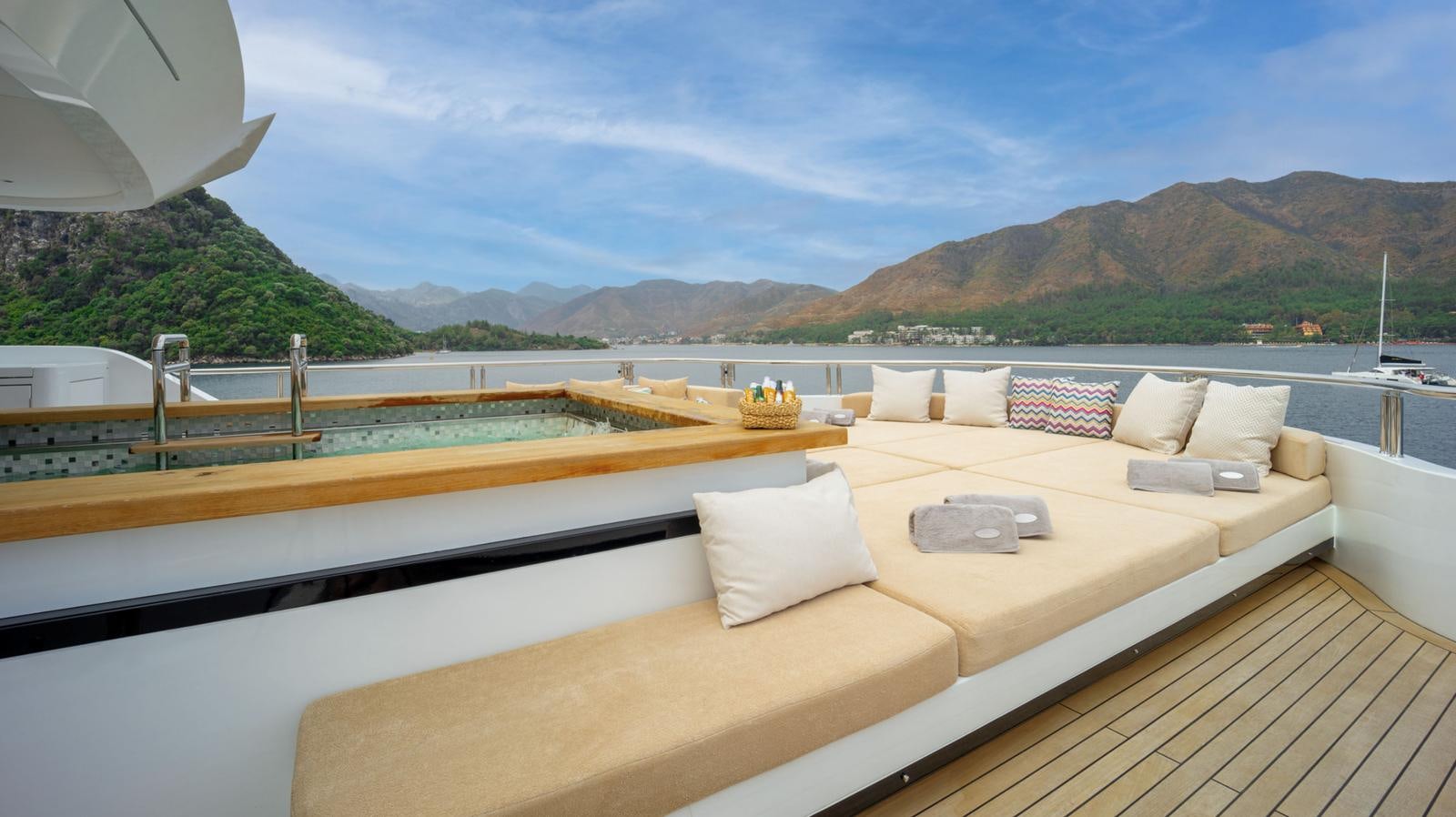 a large bed with a couch on it aboard M 47 Yacht for Sale
