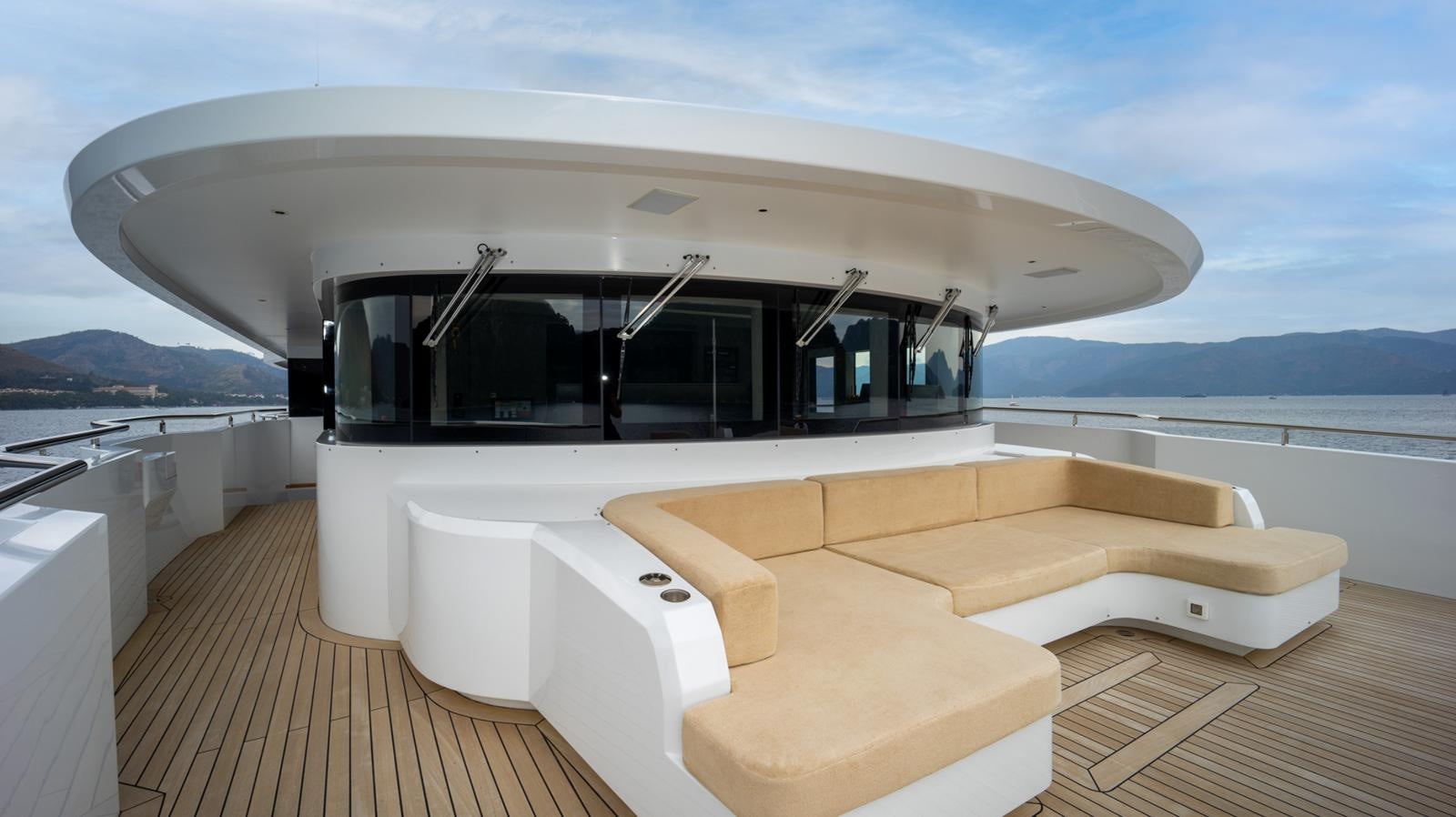 a room with a couch and a pool aboard M 47 Yacht for Sale