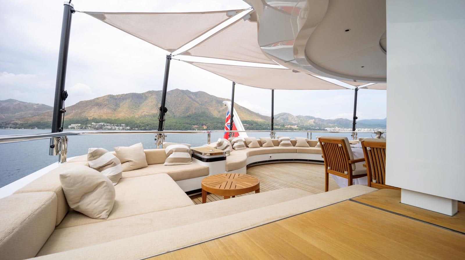 a room with a bed and a flag on the wall aboard M 47 Yacht for Sale