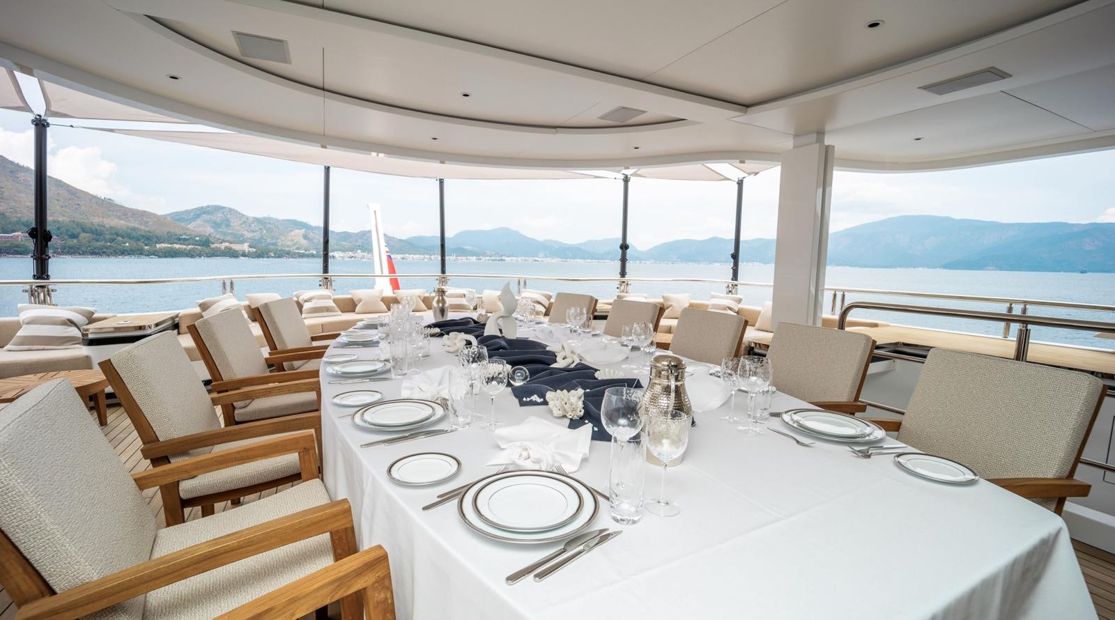 a table set for a dinner aboard M 47 Yacht for Sale