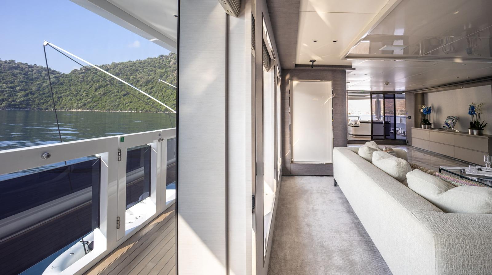 a room with a bed and a large window aboard M 47 Yacht for Sale